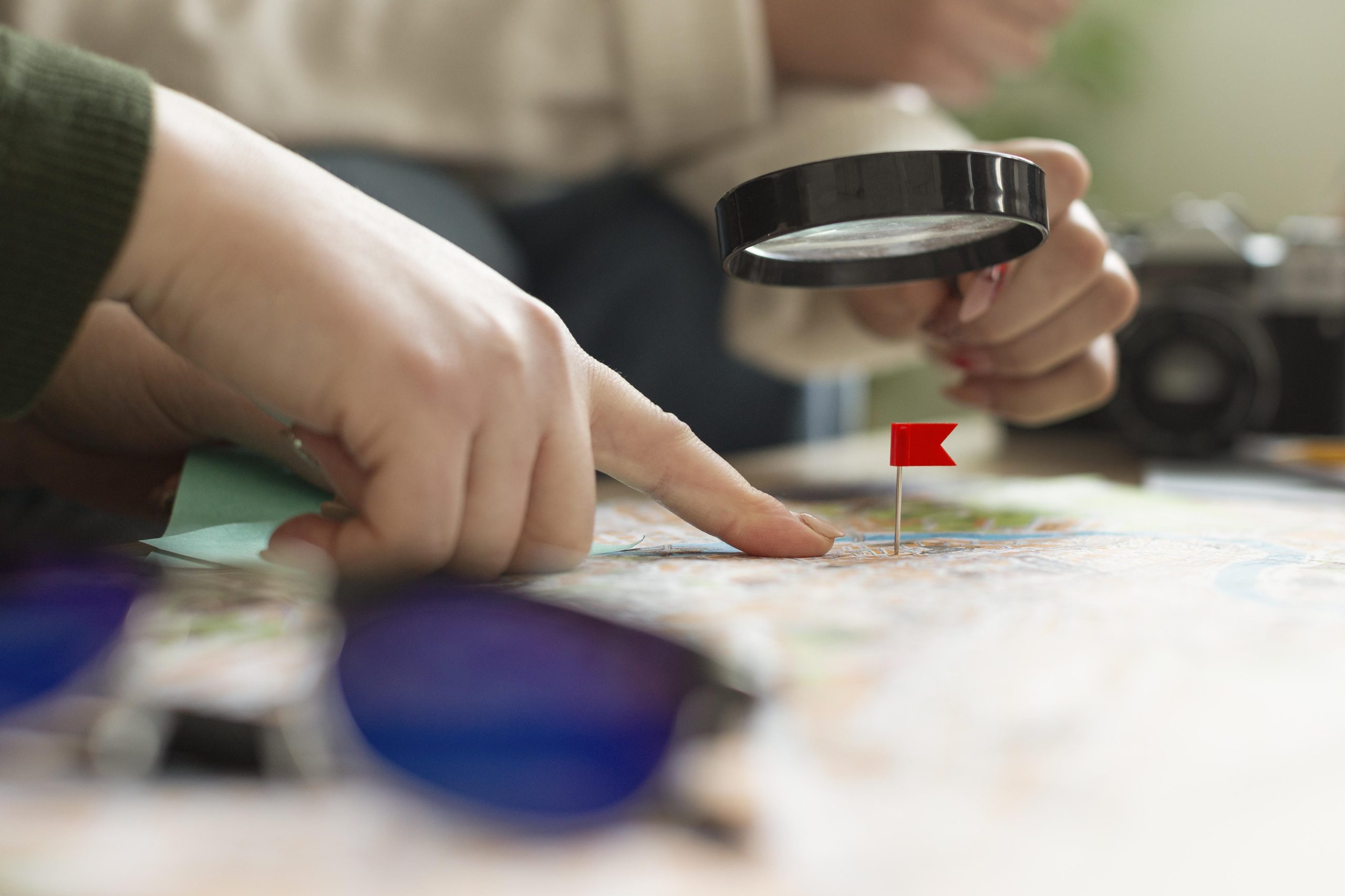 close up hand having magnifying glass scaled 1